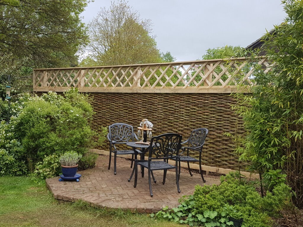 Timber framed willow hurdle fence with trellis in Abingdon, Oxfordshire