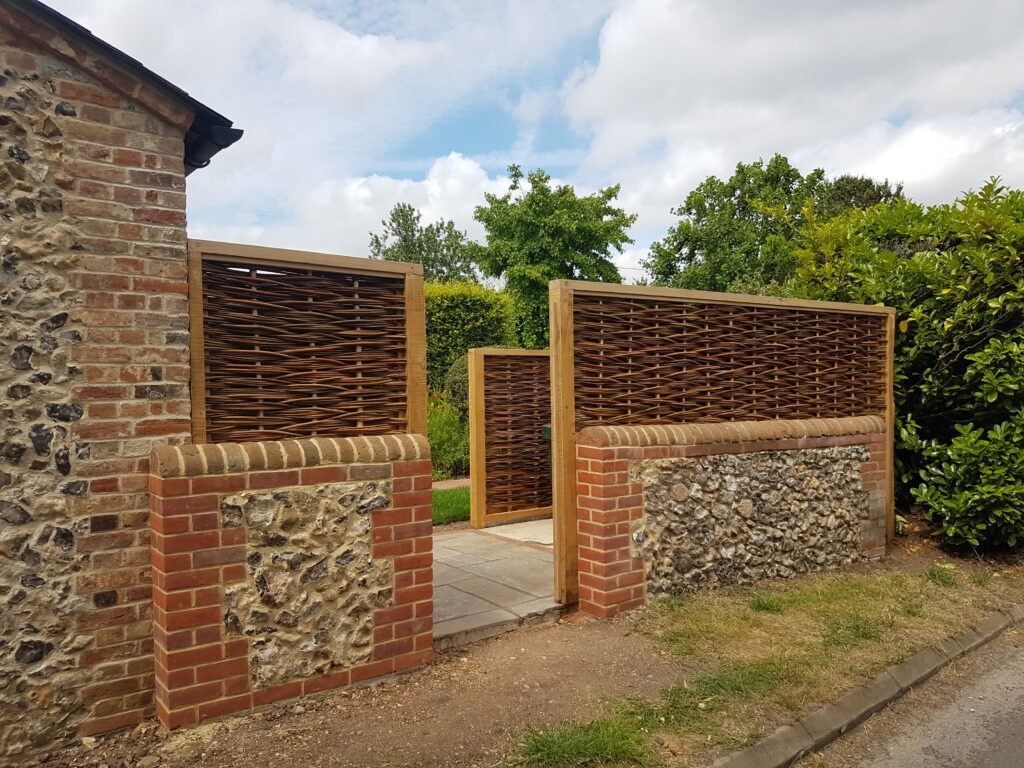 framed willow hurdle on a wall, near Reading, Berkshire