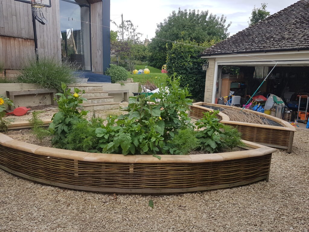 pair of bespoke matching curved woven willow raised beds